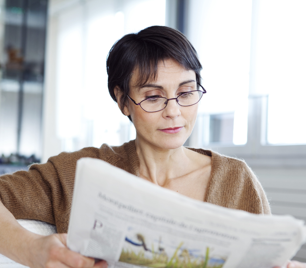 woman reading with her glasses on